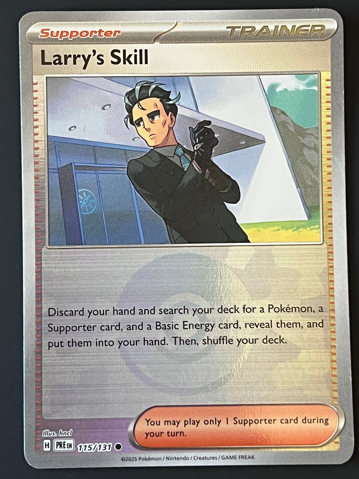 115/131 Larry’s Skill - Pokémon Prismatic Evolutions Common Reverse POKEBALL