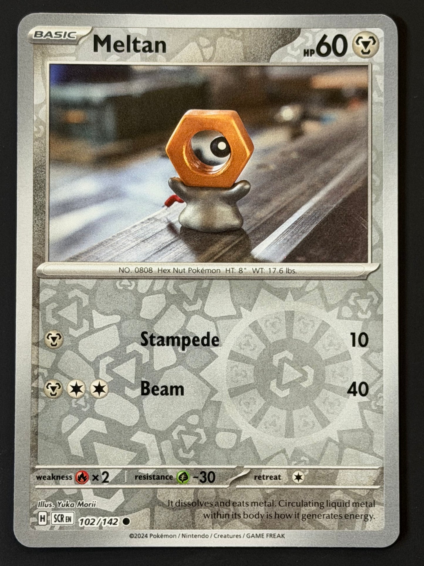102/142 Meltan - Pokémon Stellar Crown Common Reverse